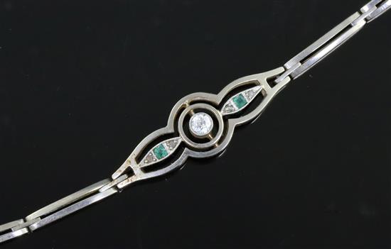 A 1940s 14ct gold and platinum, emerald and diamond set openwork bracelet, 21.5cm.